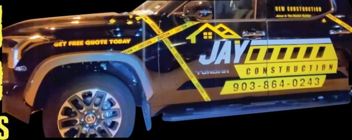 Jay Construction pickup with custom vehicle graphics